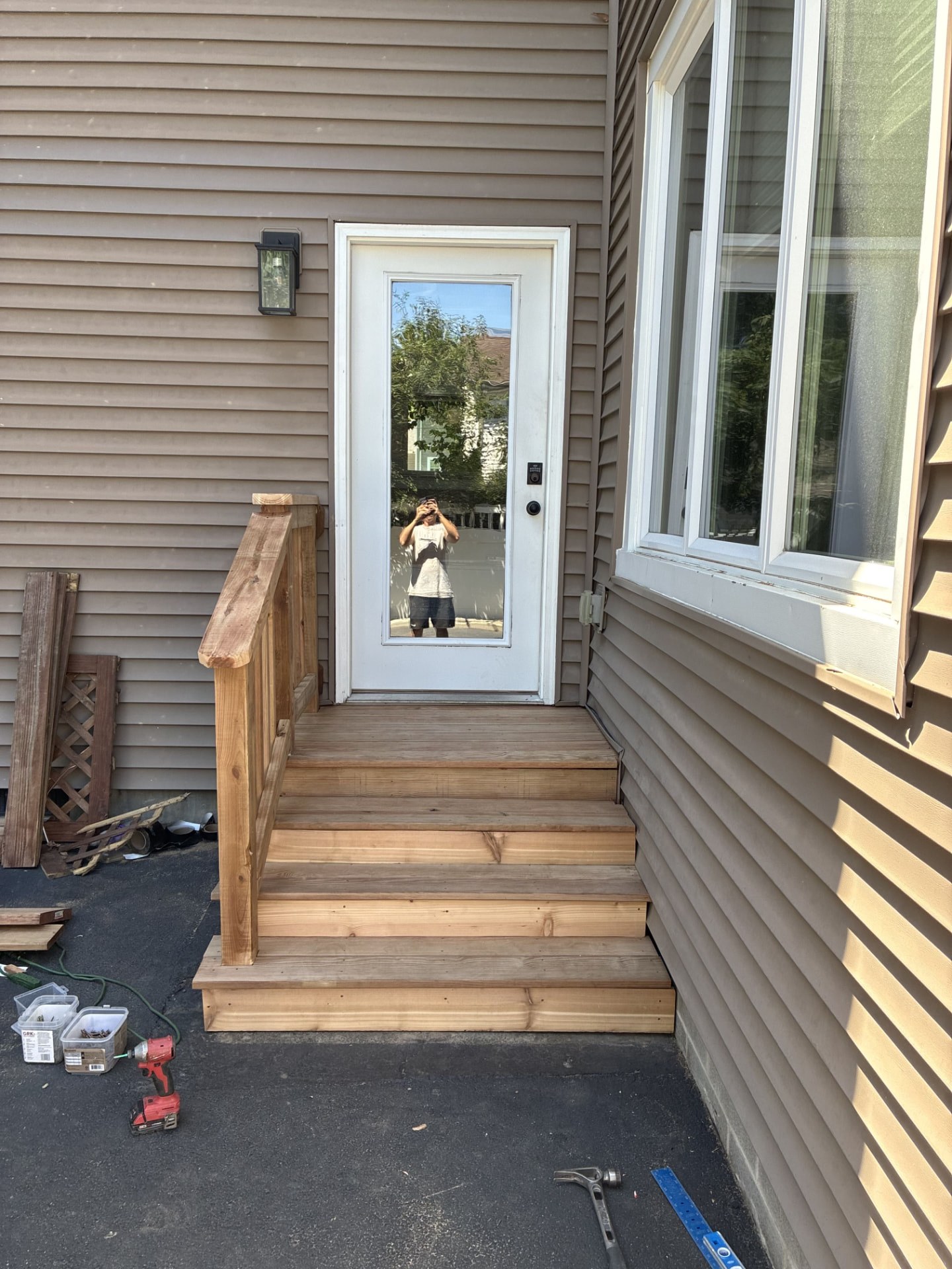 Cedar entry steps and landing built at a side door