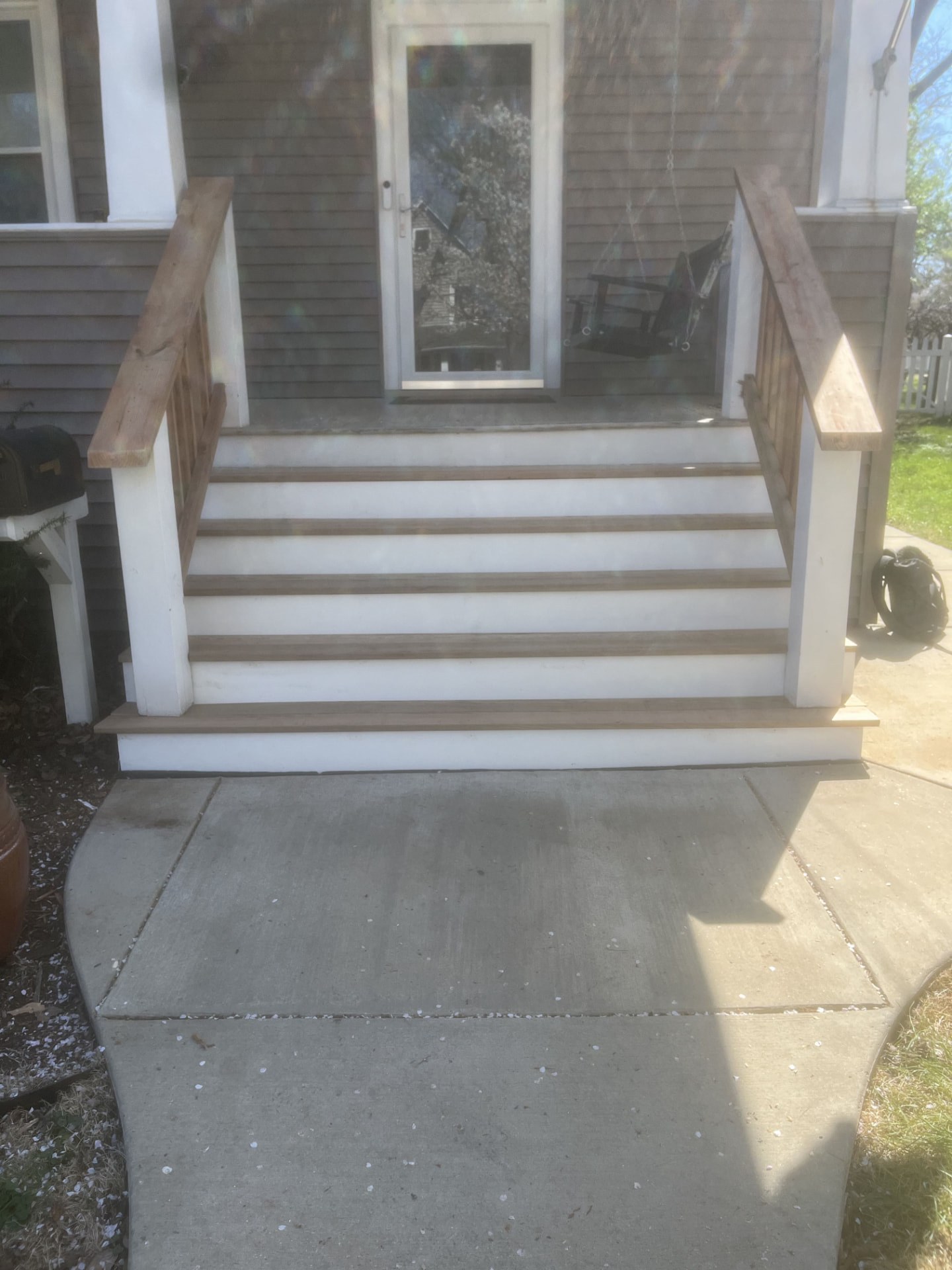 Rebuilt front porch steps with wood treads and painted risers