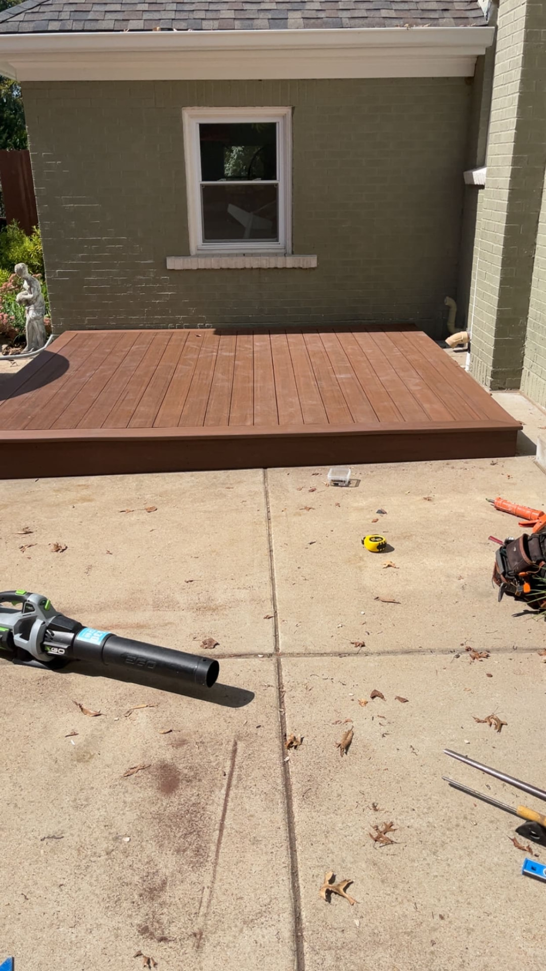 Low-profile composite deck built off a brick home in St. Louis County