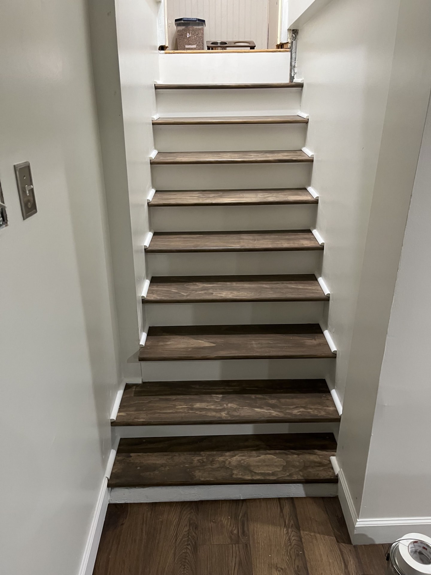 Basement staircase rebuilt with stained treads and painted risers