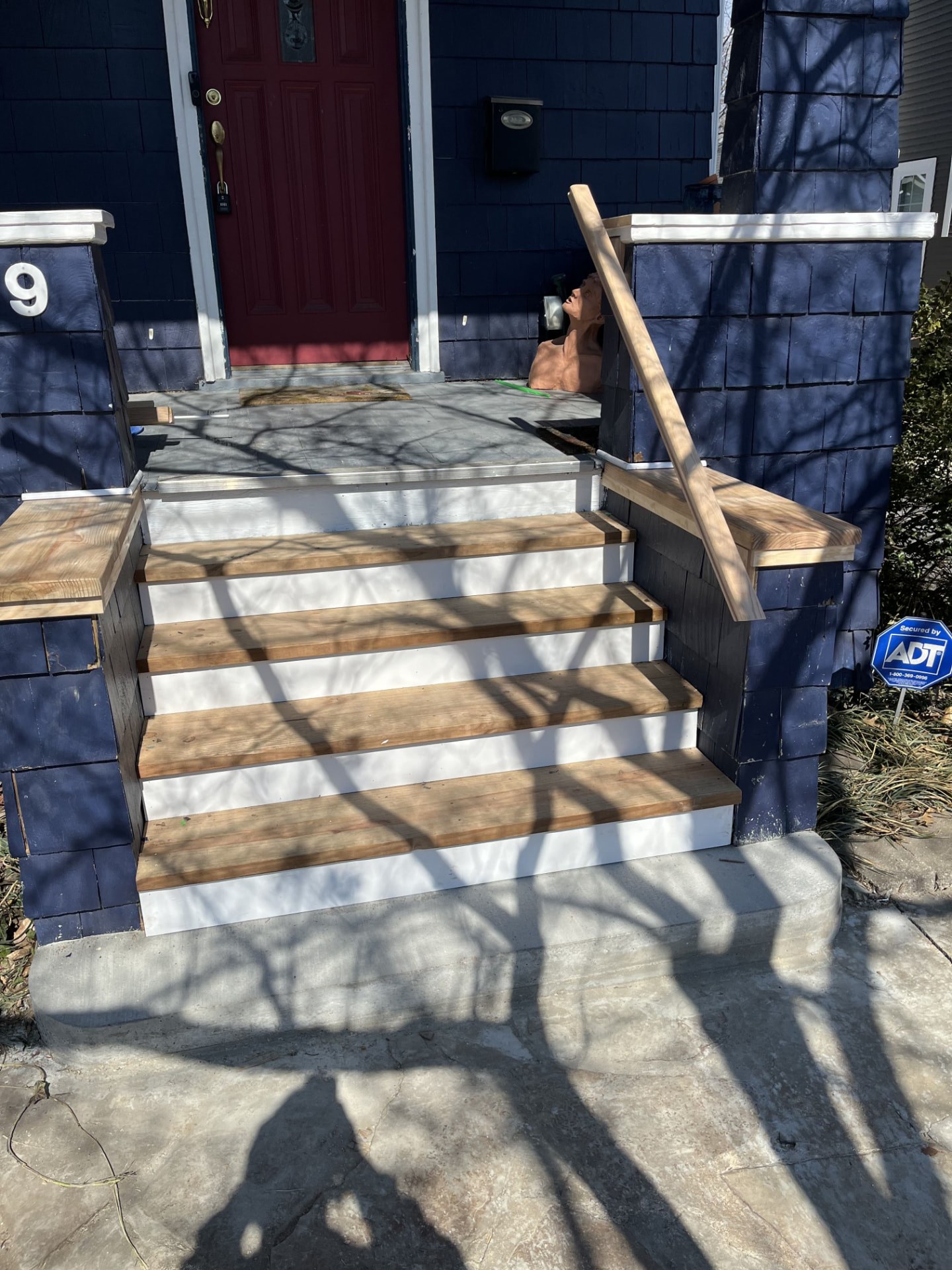 New front entry steps and handrail built for a St. Louis bungalow