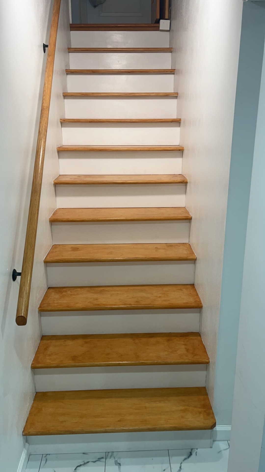 Custom interior staircase with wood treads and white risers